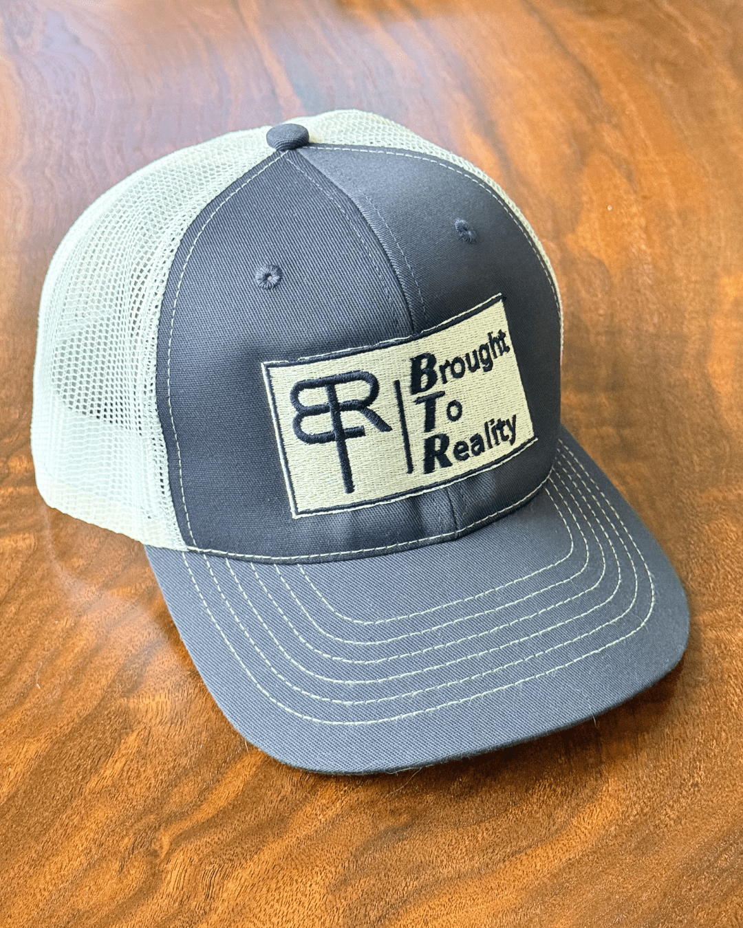 The Conversation Trucker Hat - Brought To Reality